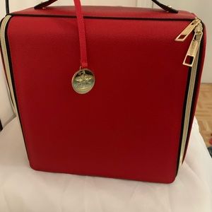 Estée Lauder square Red Cosmetics bag.